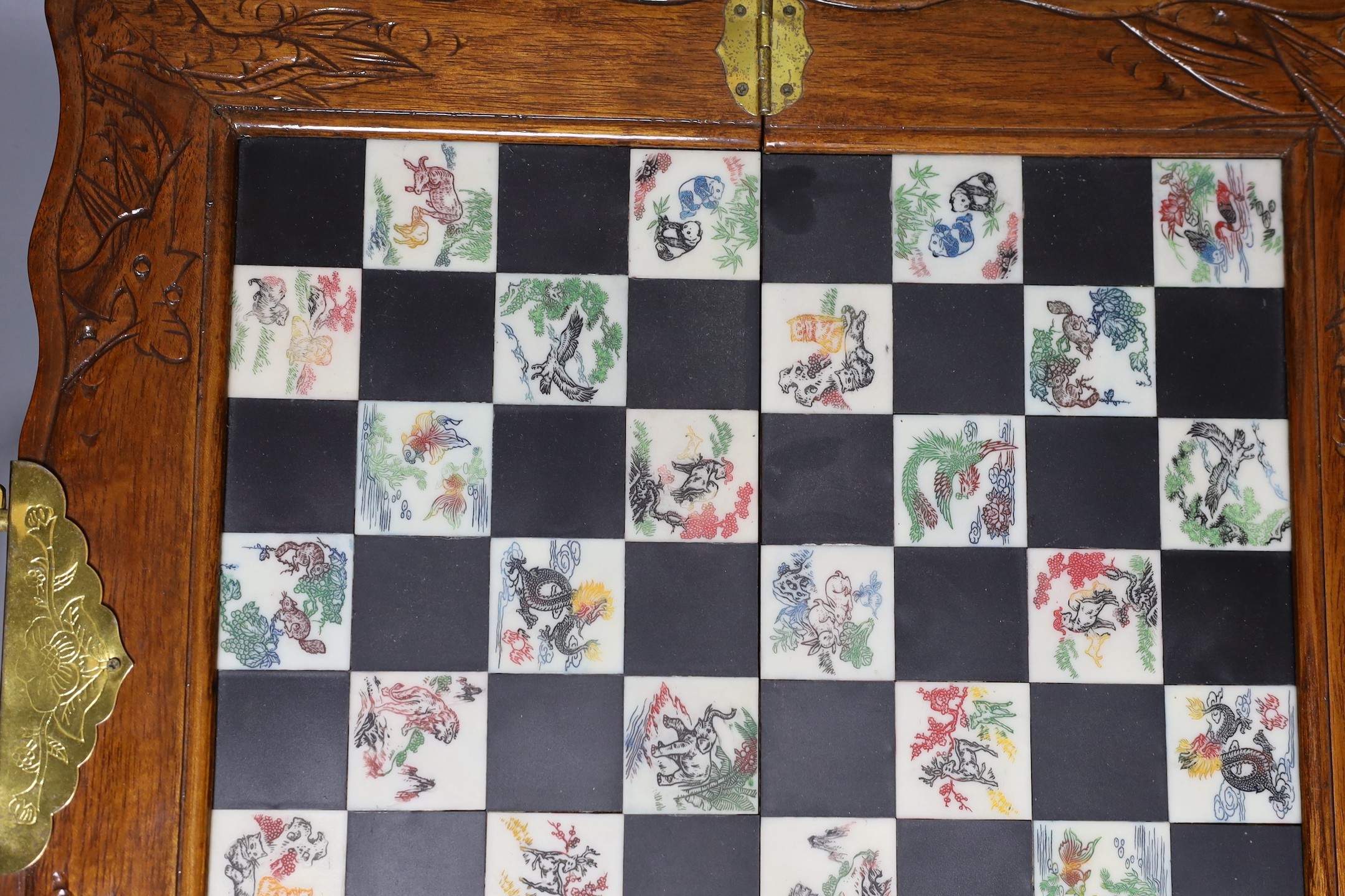 A Chinese chess set with resin pieces, 39x39cm